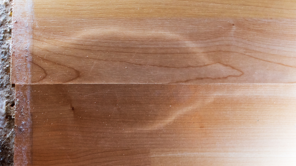 Bubbling and damage caused to laminate flooring planks after getting wet.